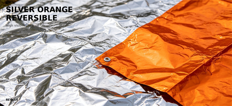 Silver and orange reversible emergency foil blanket shown from both sides for bulk procurement review Silver and orange reversible emergency foil blanket shown from both sides for bulk procurement review