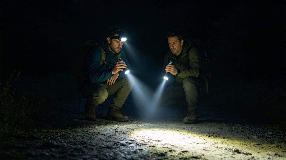 LED headlamp and handheld flashlight being used in dark emergency situation illuminating path LED headlamp and handheld flashlight being used in dark emergency situation illuminating path