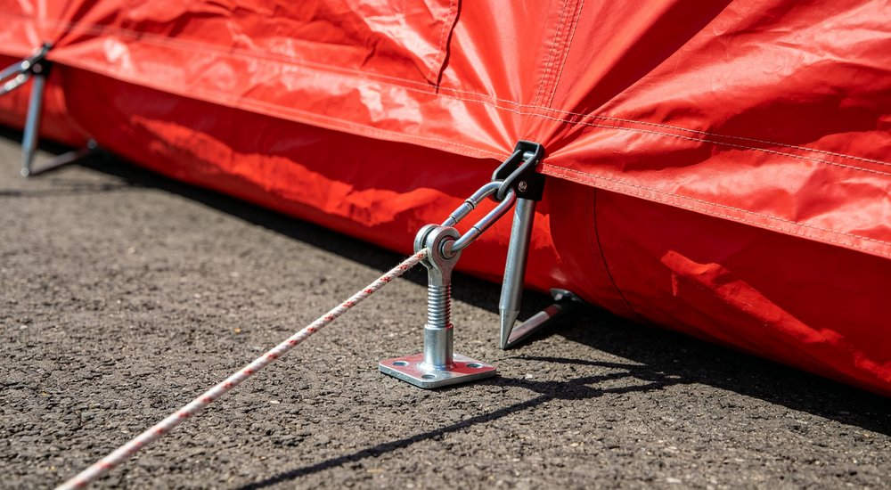 Side by side comparison of standard camping inflatable tent vs professional fire rescue command tent, size difference visible, red fire tent dominant, professional product photography