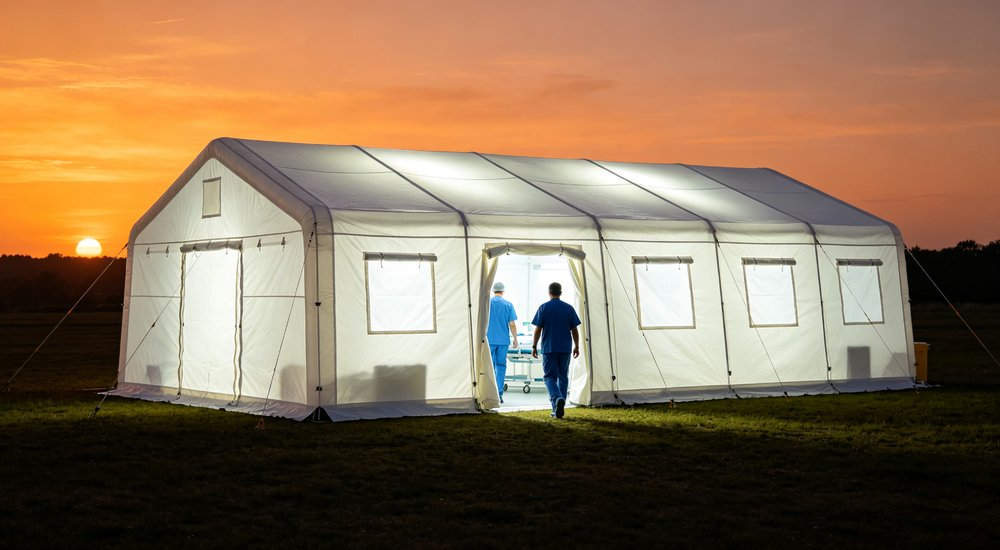 Ventilation system for inflatable medical tent showing airflow, FAQ illustration red and white inflatable emergency shelter for disaster relief operations