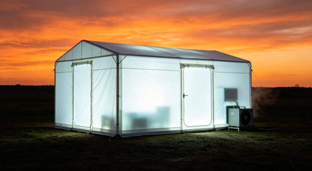 Night operation of inflatable isolation tent with interior lighting, medical workers on duty red and white inflatable emergency shelter for disaster relief operations