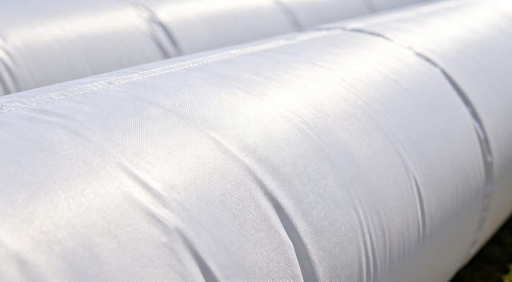 Close-up of inflatable air beam showing PVC fabric texture, detailed product shot red and white inflatable emergency tent for disaster relief operations