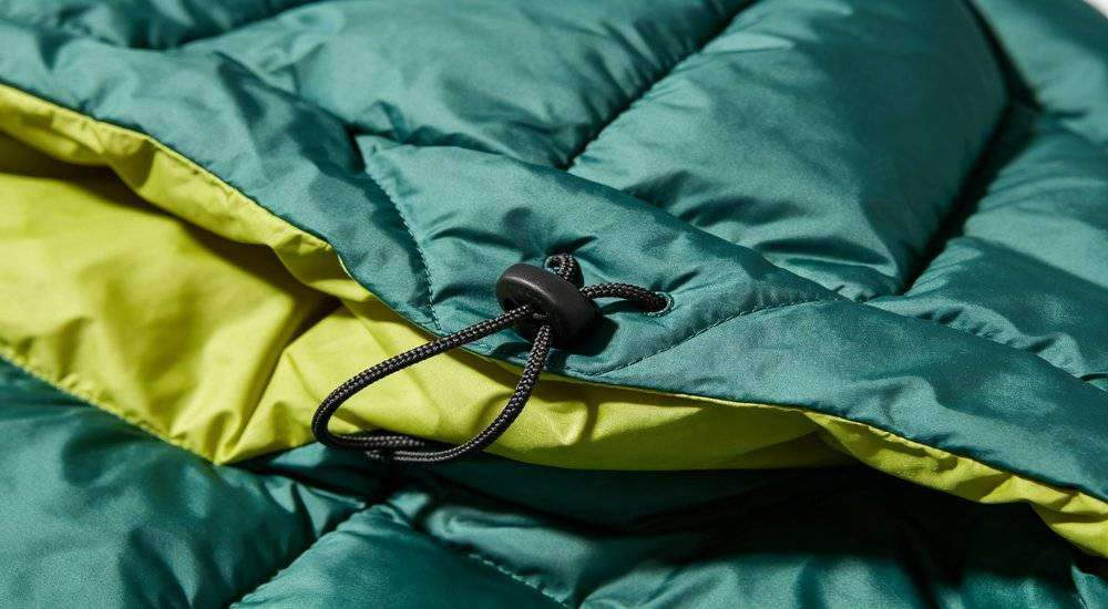 Close up of sleeping bag hood and drawstring detail head coverage design feature quality craftsmanship Close up of sleeping bag hood and drawstring detail head coverage design feature quality craftsmanship