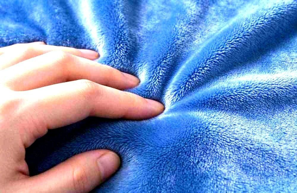 Close-up of polyester bedding fabric texture for chlorine wash tolerance checks, showing disinfectable bedding health programs quality verification standards, chlorine-safe emergency blankets