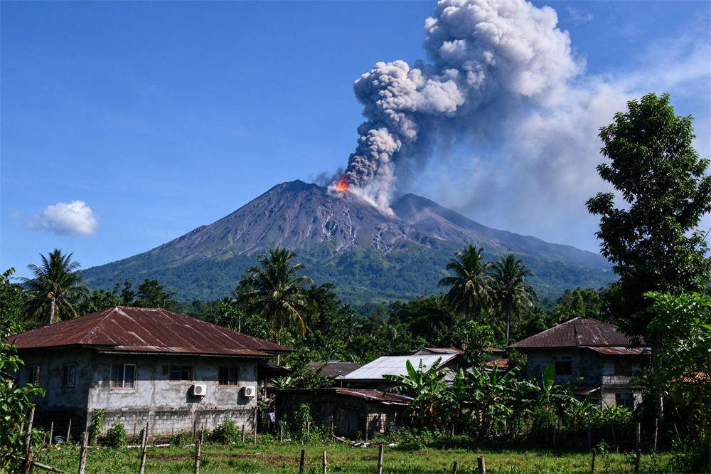 Volcano emergency kit eruption scene with black smoke billowing from crater, village in foreground, volcanic ash preparedness Volcano emergency kit eruption scene with black smoke billowing from crater, village in foreground, volcanic ash preparedness